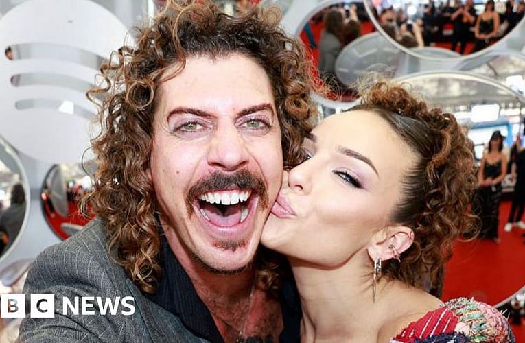 Australian musician's US ban prompts apology from girlfriend over Trump post – BBC